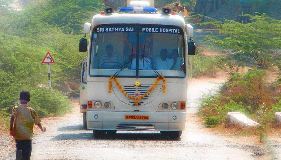 The Sri Sathya Sai Mobile Hospital bus on a village road
